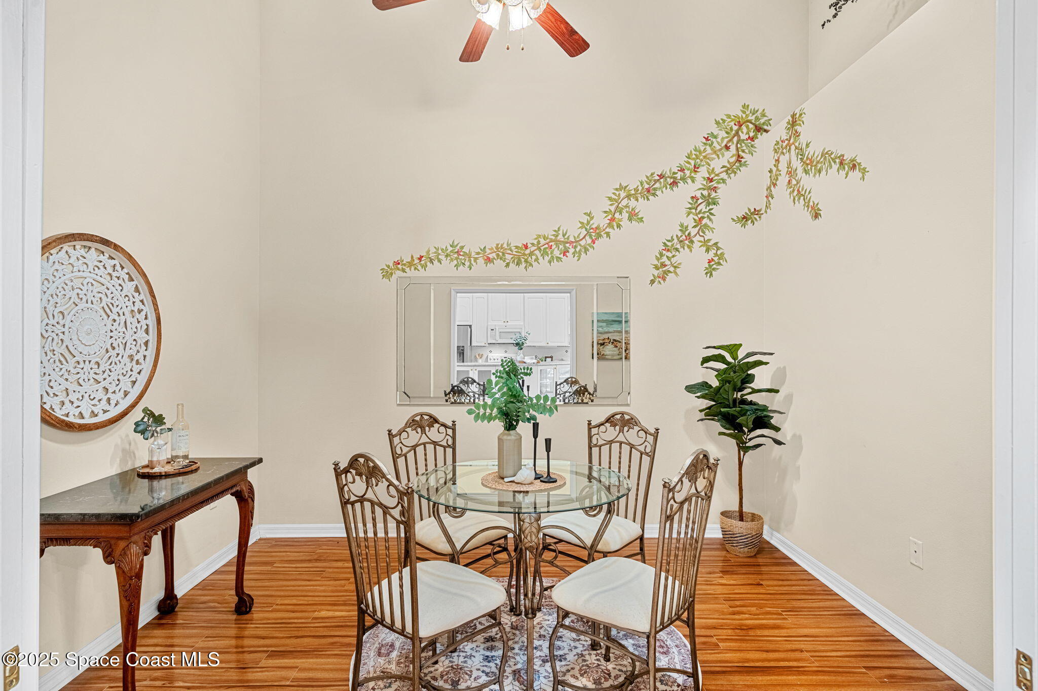 2700 Camberly Circle Melbourne, FL 32940 - Photo 14 of 50 a view of a dining room with furniture and wooden floor