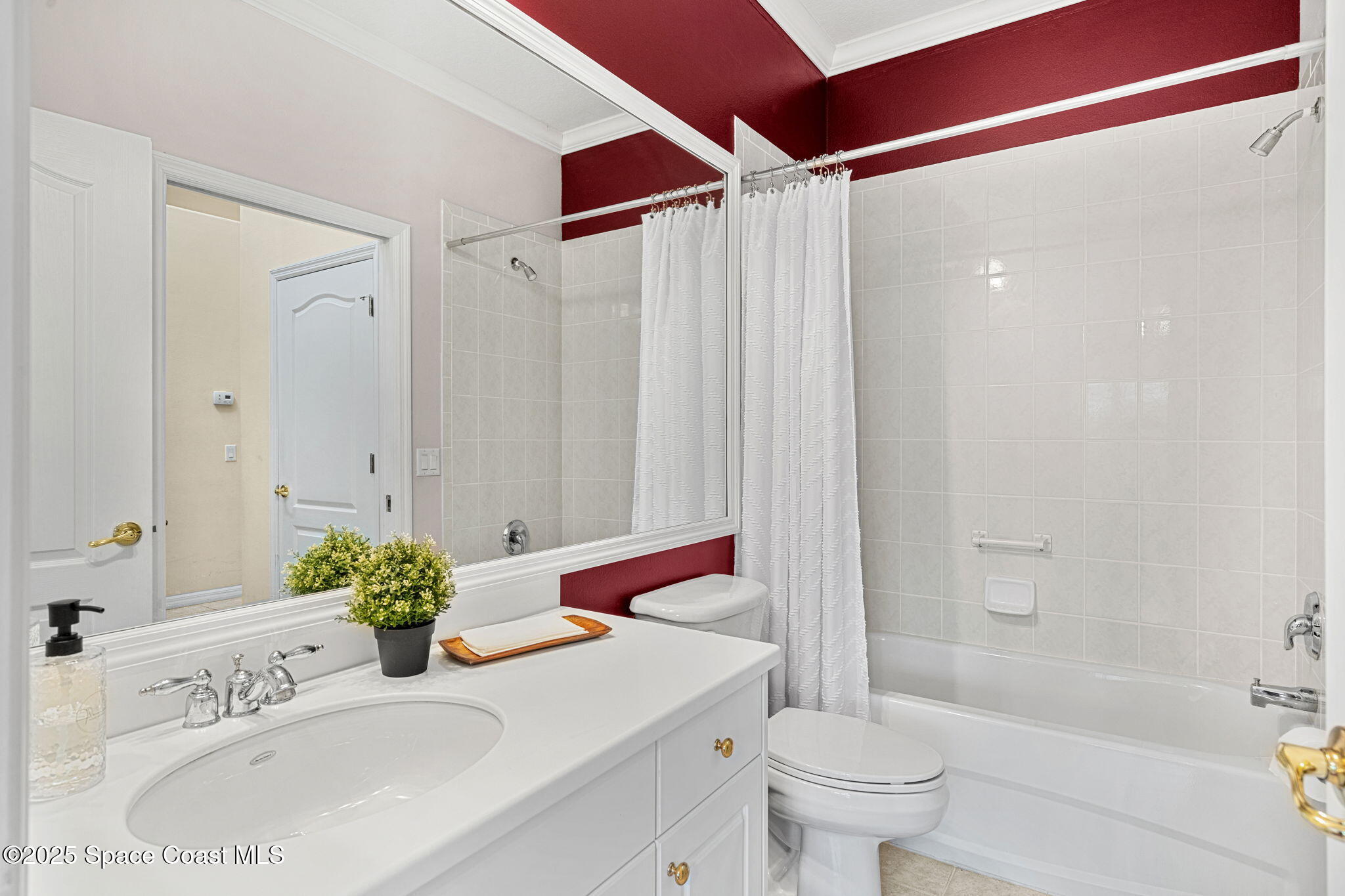 2700 Camberly Circle Melbourne, FL 32940 - Photo 19 of 50 a bathroom with a sink and a mirror