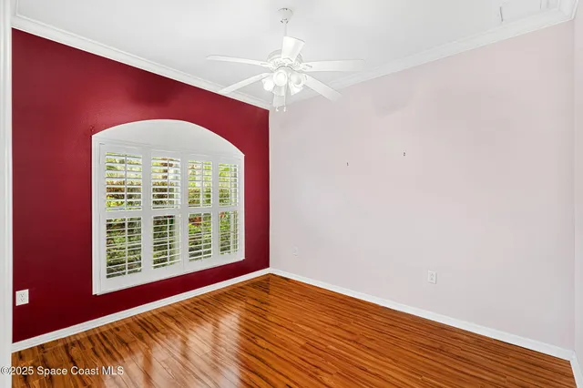 a view of a hardwood floor and an entryway