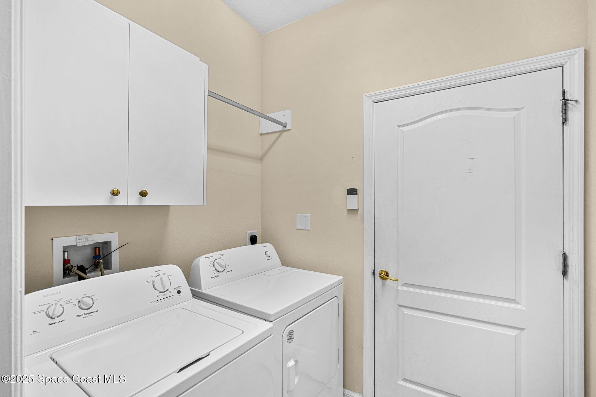 2700 Camberly Circle Melbourne, FL 32940 - Photo 22 of 50 a utility room with dryer and washer