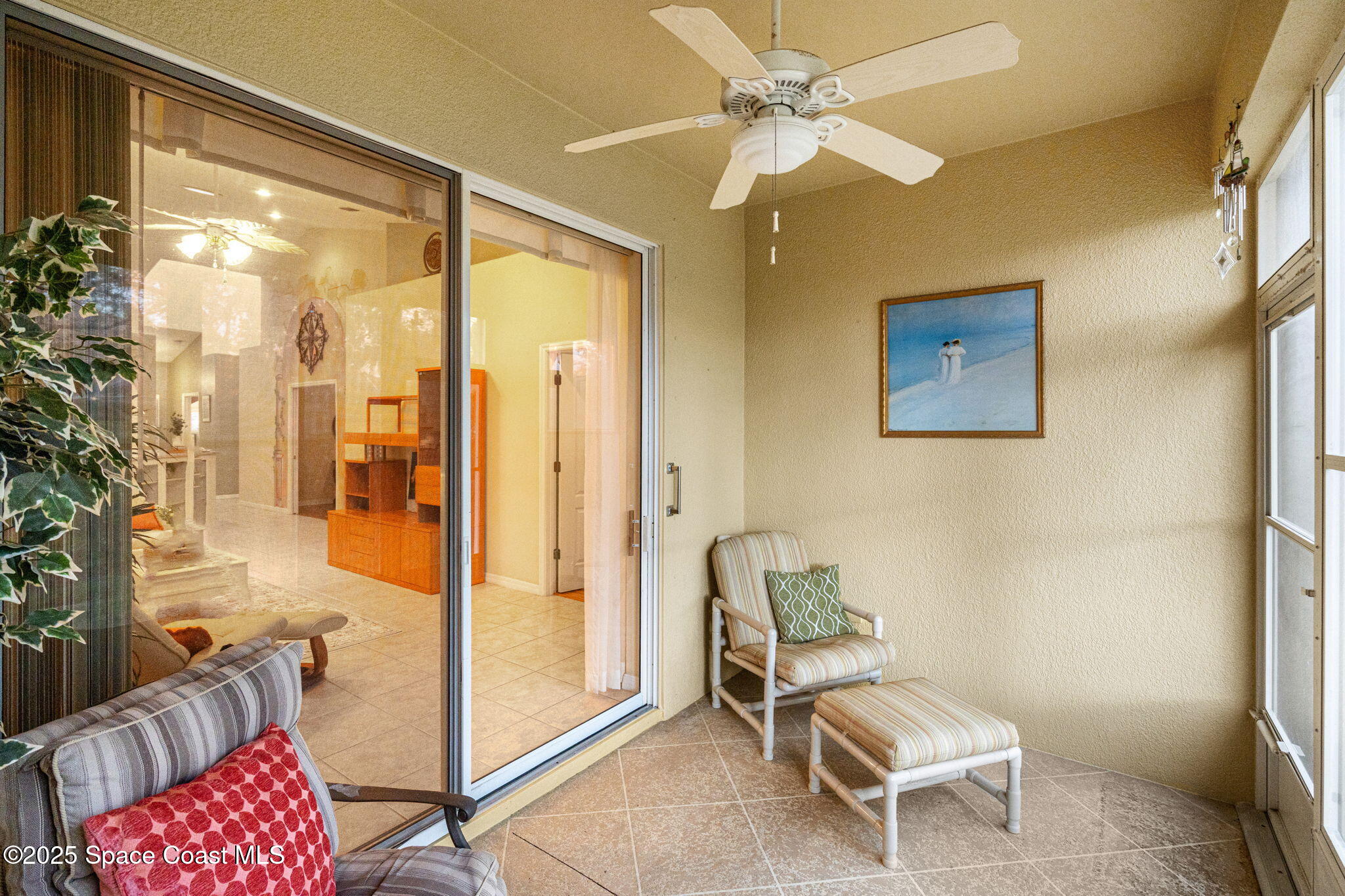 2700 Camberly Circle Melbourne, FL 32940 - Photo 23 of 50 a living room with furniture and a chandelier