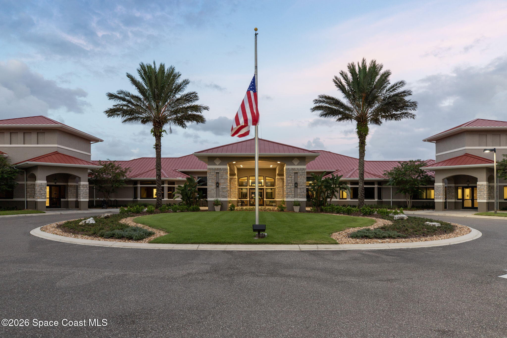 2700 Camberly Circle Melbourne, FL 32940 - Photo 29 of 50 a front view of multi story residential apartment building with yard and sign board