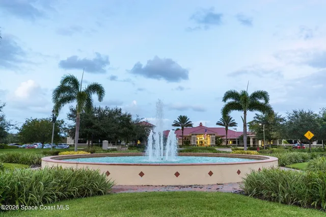 a view of a swimming pool with a lot of trees & houses