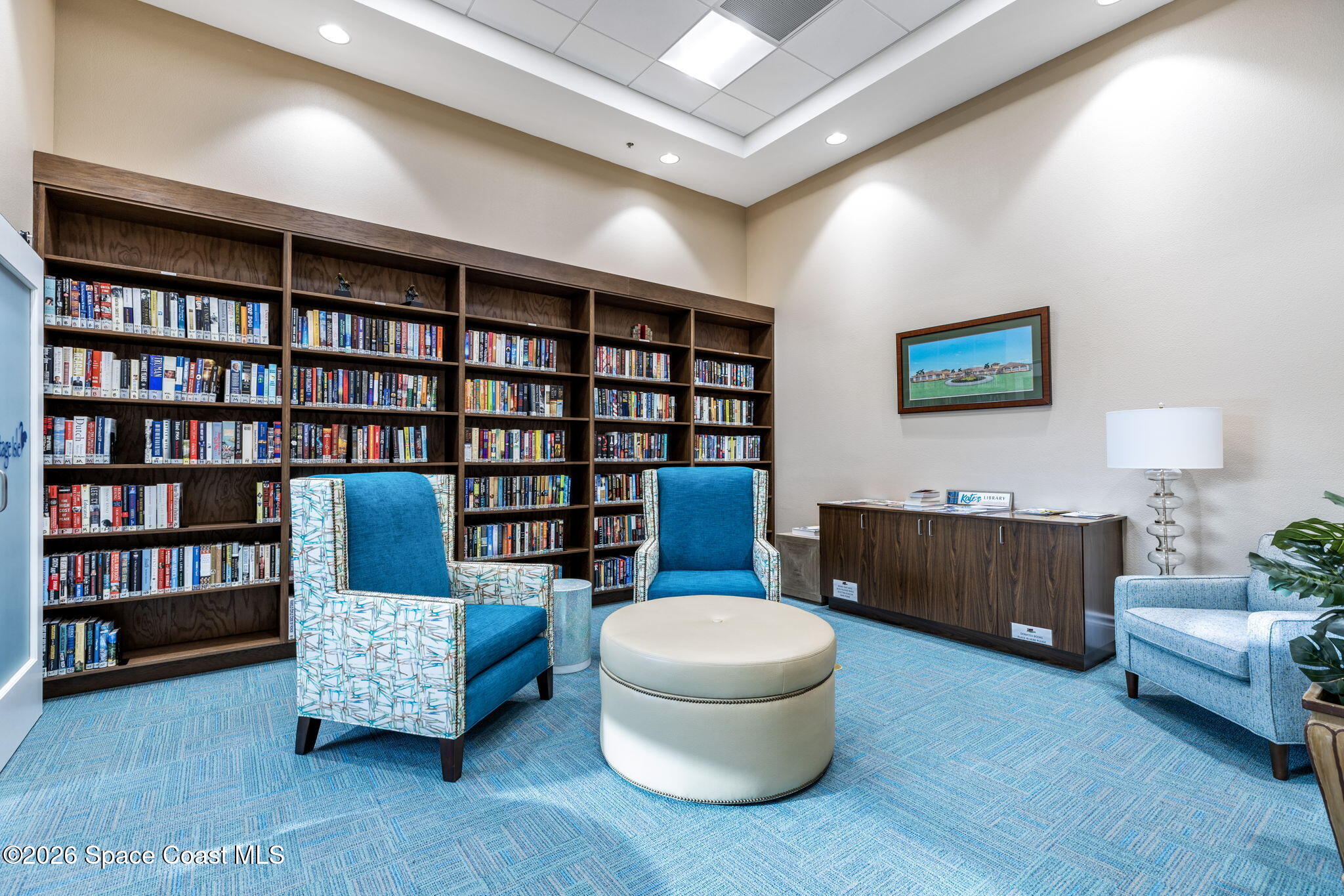 2700 Camberly Circle Melbourne, FL 32940 - Photo 43 of 50 a living room with couch and a bookshelf
