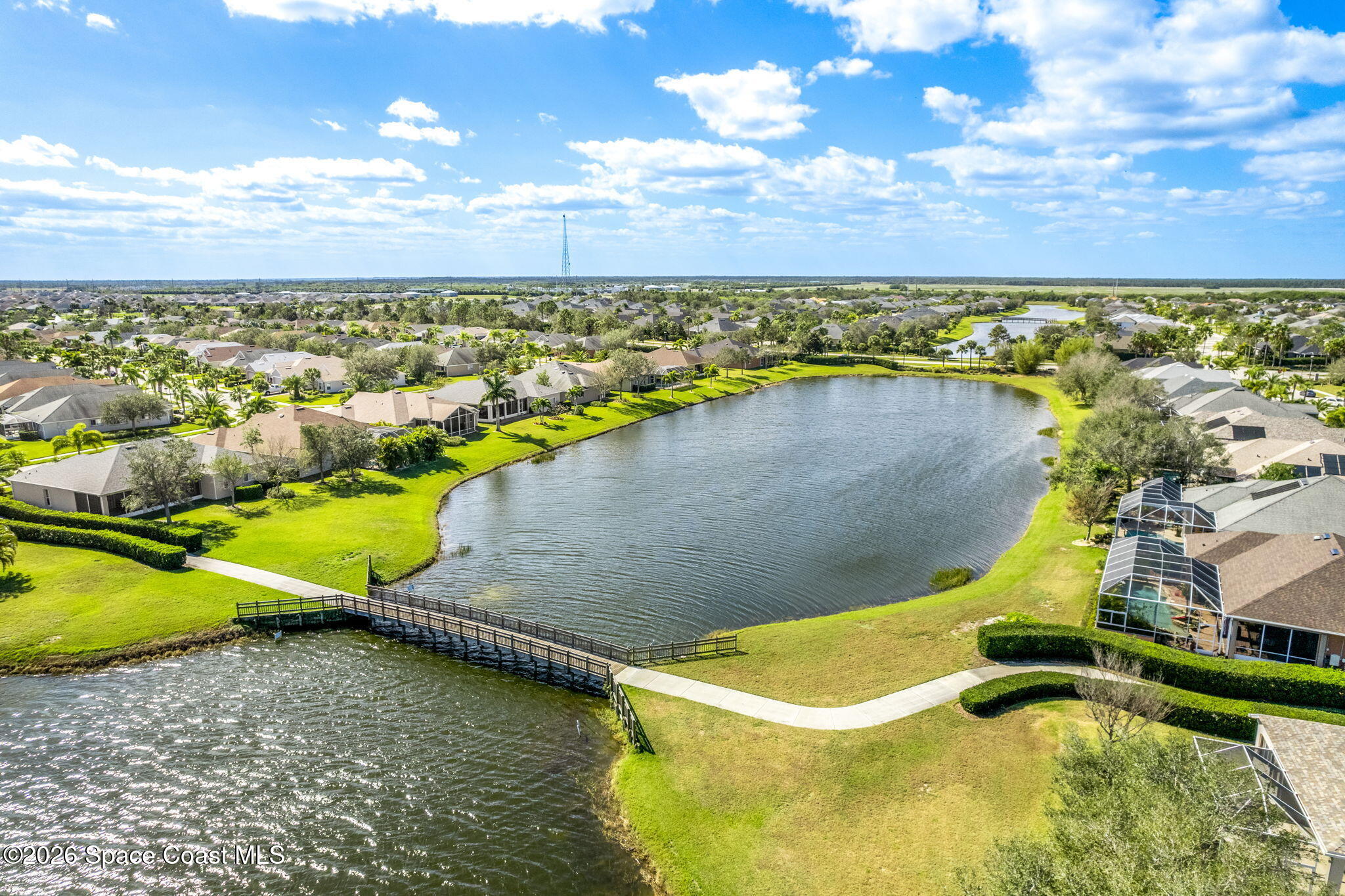 2700 Camberly Circle Melbourne, FL 32940 - Photo 47 of 50 a view of a swimming pool with an outdoor seating and a yard