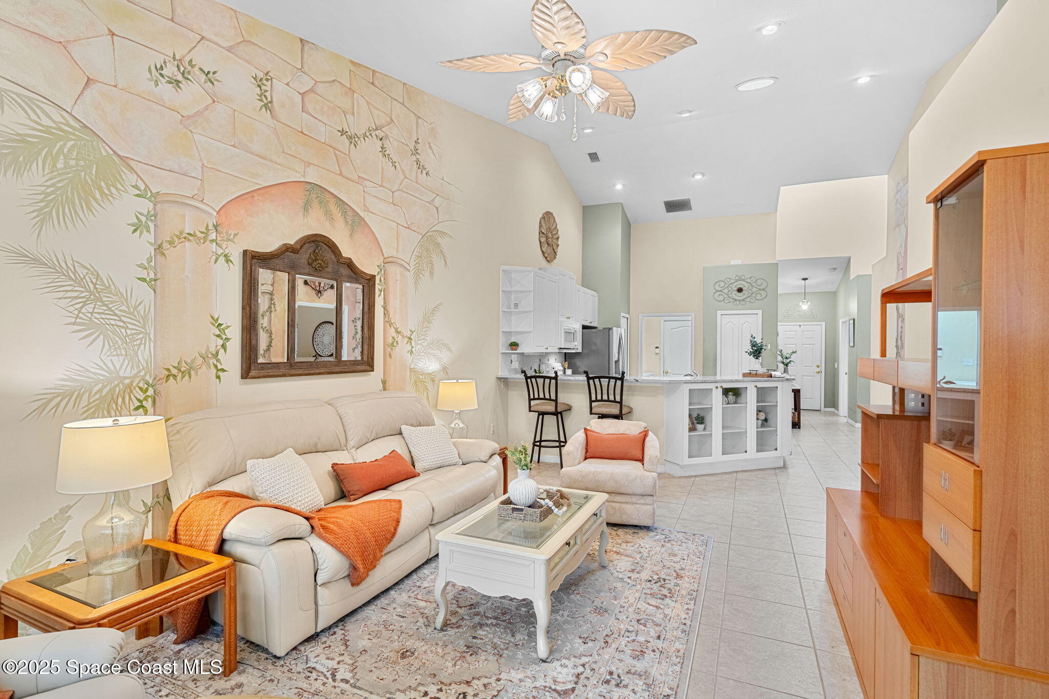 2700 Camberly Circle Melbourne, FL 32940 - Photo 6 of 50 a living room with fireplace furniture and a rug