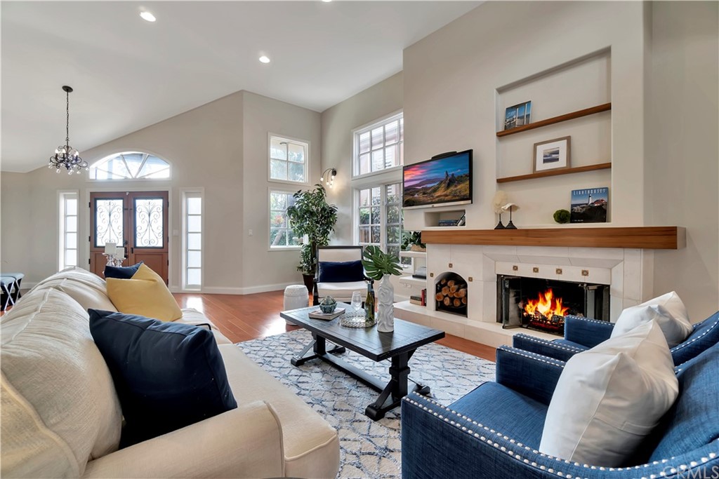 Living Room - Feel the sea breeze through the double Dutch doors or cozy up in front of the fireplace.