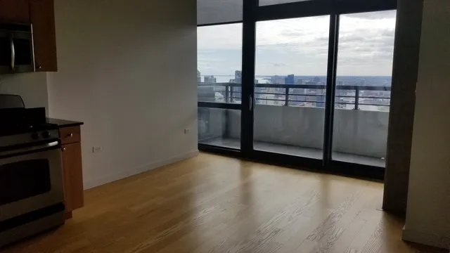 a bathroom with a sink toilet vanity and bathtub