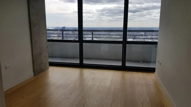 a kitchen with a refrigerator a stove top oven a sink and cabinets