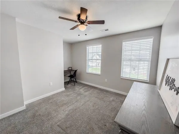 a view of a livingroom with a ceiling fan