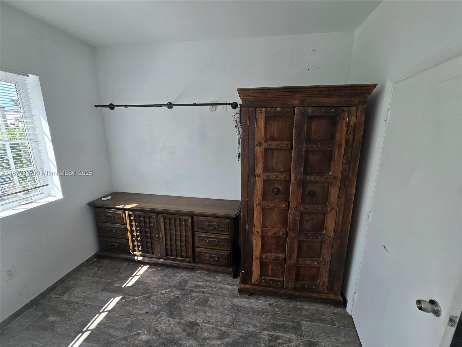 1345 Pennsylvania Avenue, Unit 2C Miami Beach, FL 33139 - Photo 13 of 18 a view of empty room with windows