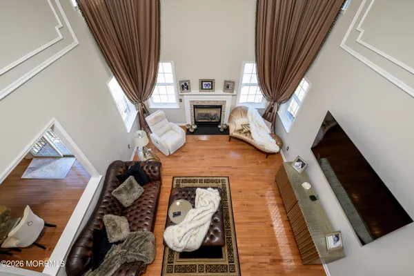 a view of a dining room with furniture and wooden floor
