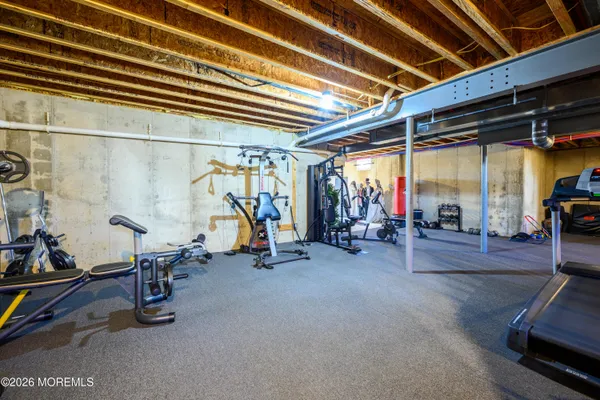 a workspace with furniture and a ceiling fan