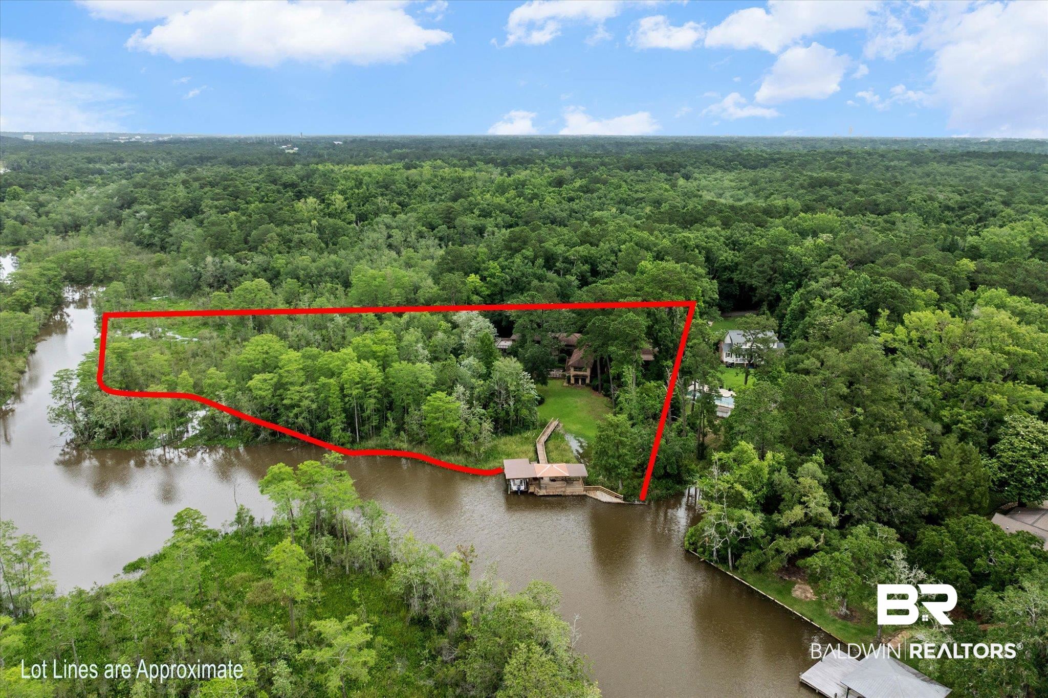 3500 Venetia Road Mobile, AL 36605 - Photo 45 of 56 Waterfront property featuring extensive tree coverage, a private dock, and a river frontage