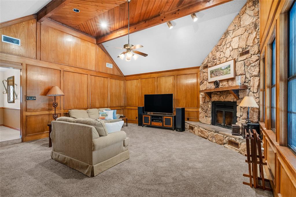 5840 Crystal Drive Midlothian, TX 76065 - Photo 8 of 36 a living room with furniture a flat screen tv and a fireplace