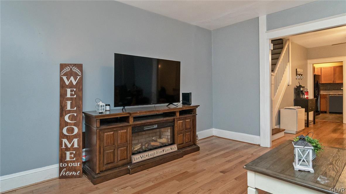 1340 Butler Street Easton, PA 18042 - Photo 3 of 18 a living room with furniture flat screen tv and rug