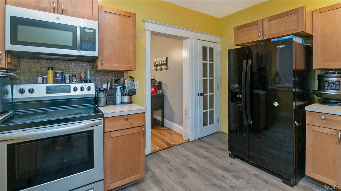 1340 Butler Street Easton, PA 18042 - Photo 8 of 18 a kitchen with stainless steel appliances granite countertop a refrigerator stove and sink
