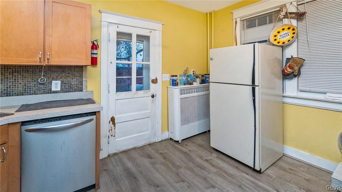 1340 Butler Street Easton, PA 18042 - Photo 9 of 18 a white refrigerator freezer sitting in a kitchen