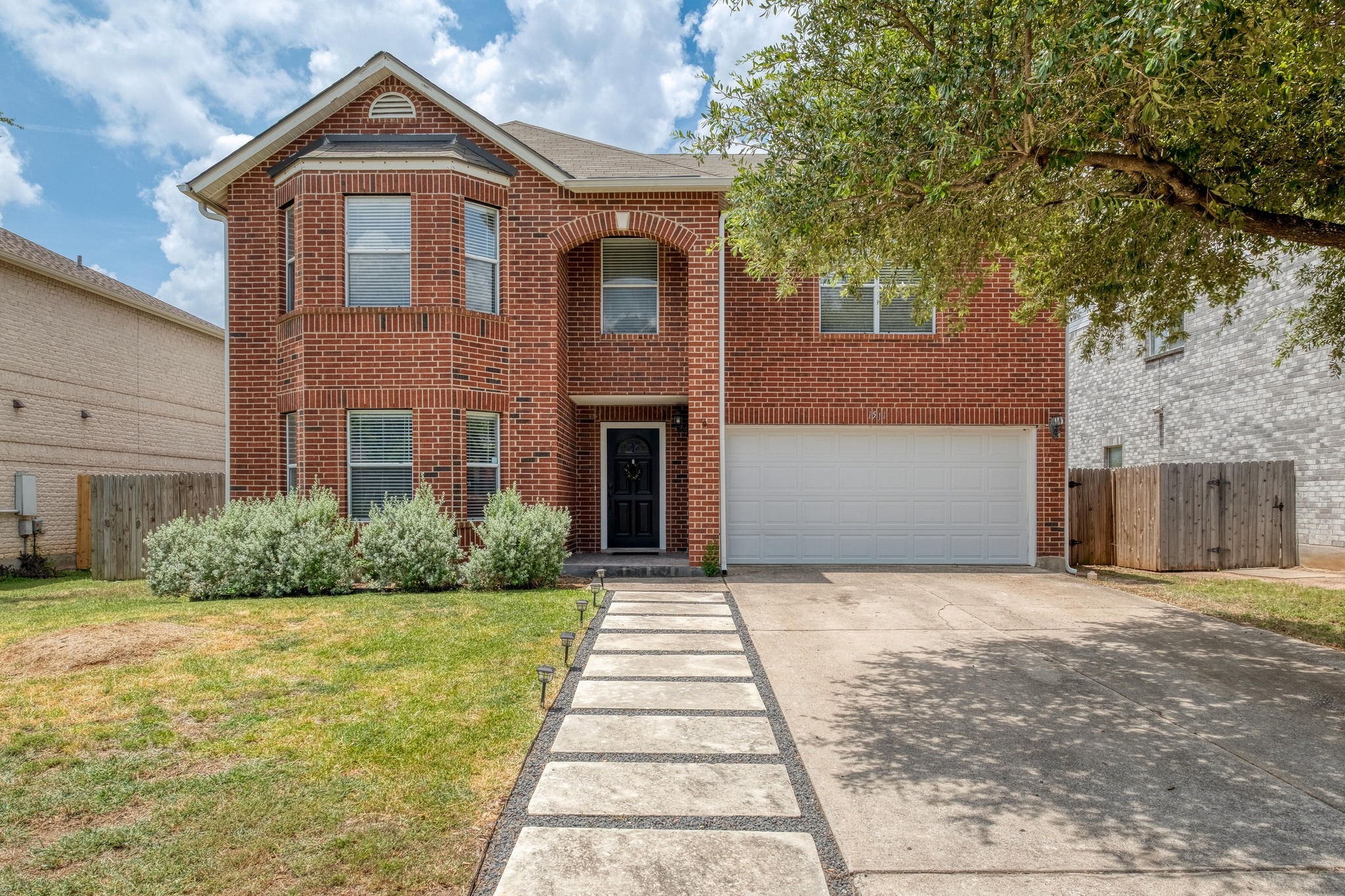 1511 Rhapsody Ridge Drive Cedar Park, TX 78613 - Photo 1 of 1 Traditional home featuring brick siding, an attached garage, and driveway