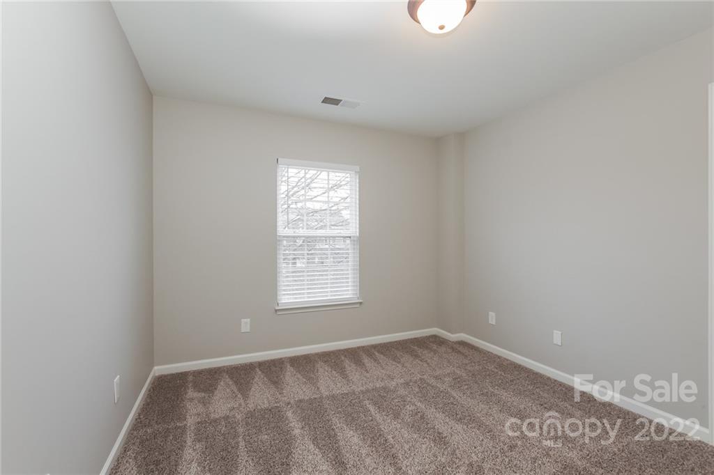 6415 Hermsley Road Charlotte, NC 28278 - Photo 11 of 15 an empty room with a window