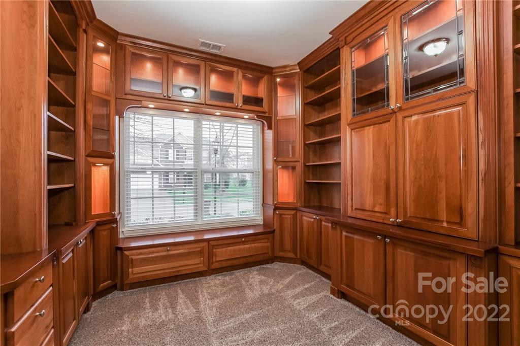 6415 Hermsley Road Charlotte, NC 28278 - Photo 8 of 15 a view of walk in closet with empty racks