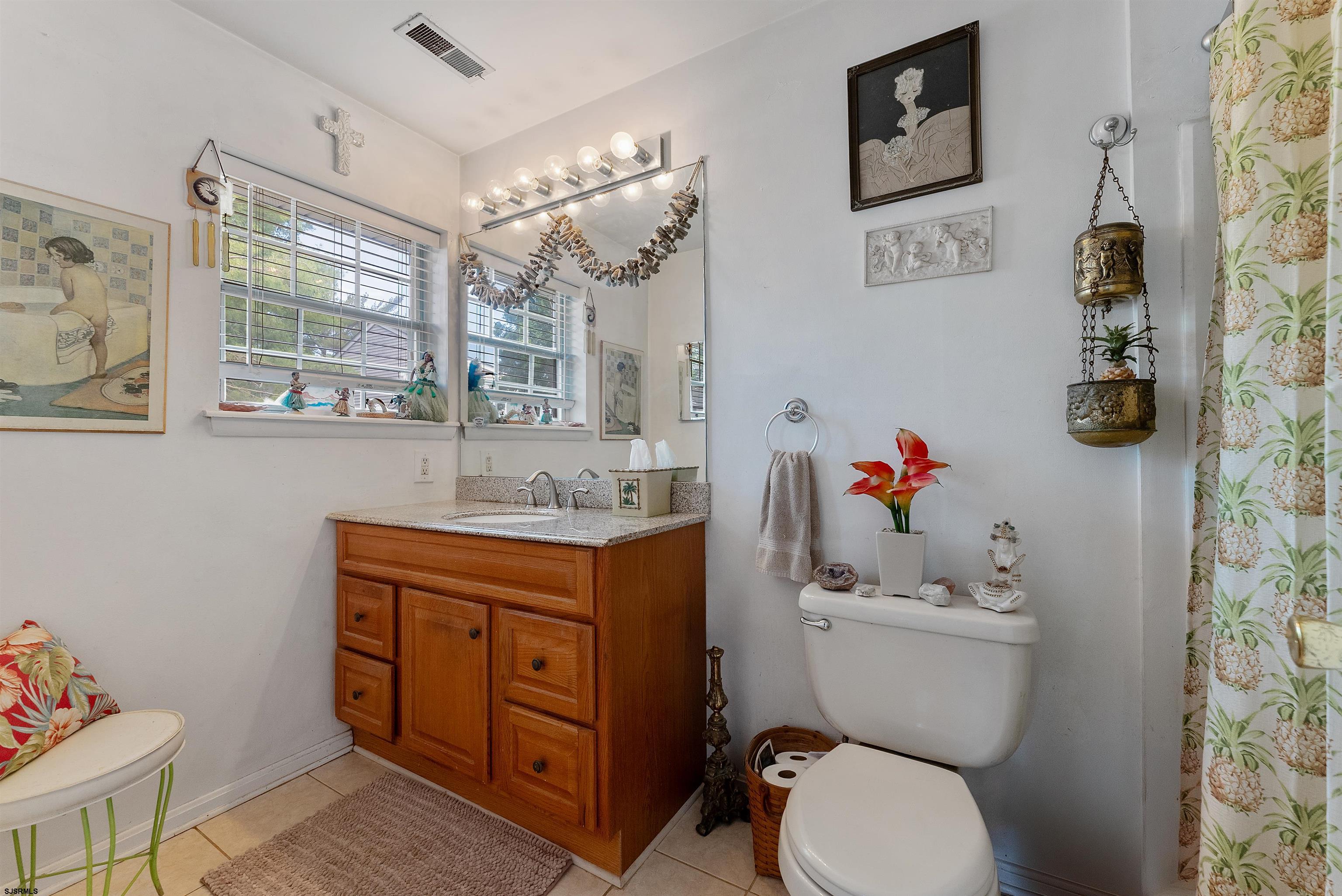 144 Meadow Ridge Road, Unit 144 Galloway Township, NJ 08205 - Photo 15 of 16 a bathroom with a granite countertop toilet sink and mirror
