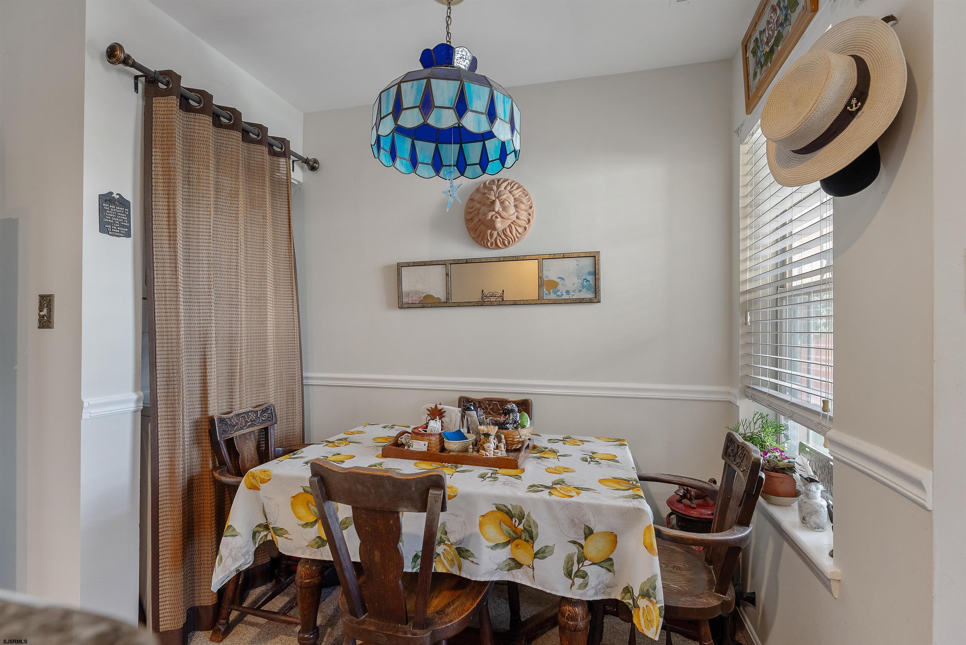 144 Meadow Ridge Road, Unit 144 Galloway Township, NJ 08205 - Photo 9 of 16 a view of a dining room with furniture and chandelier