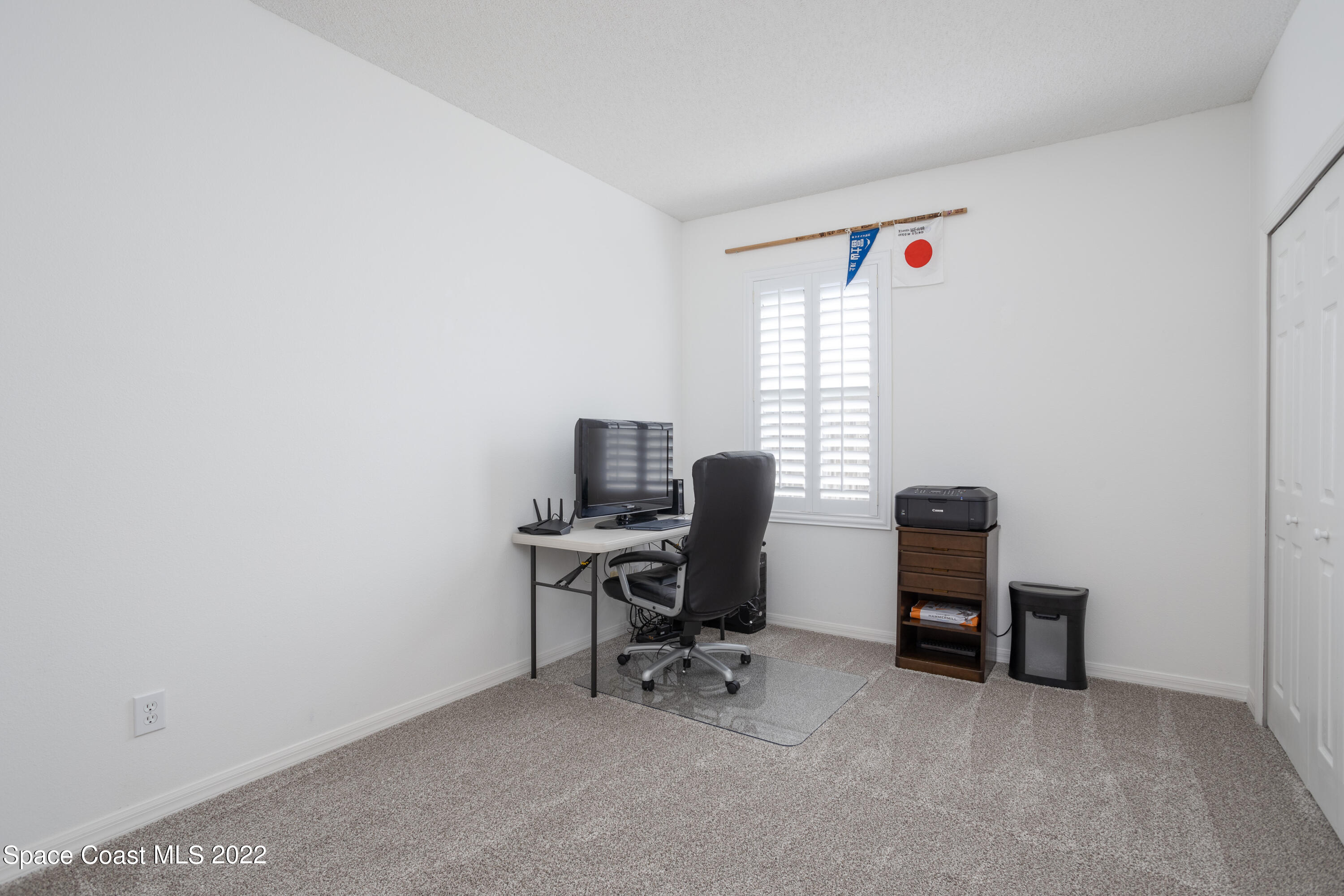 1354 Enclave Drive Rockledge, FL 32955 - Photo 25 of 30 a view of a workspace with furniture and a window