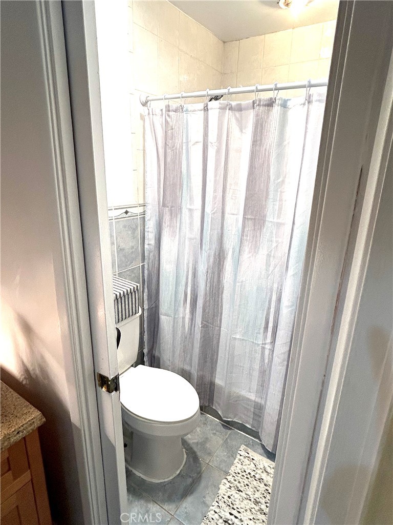 9530 Bexley Drive Pico Rivera, CA 90660 - Photo 16 of 22 a white toilet sitting next to a window