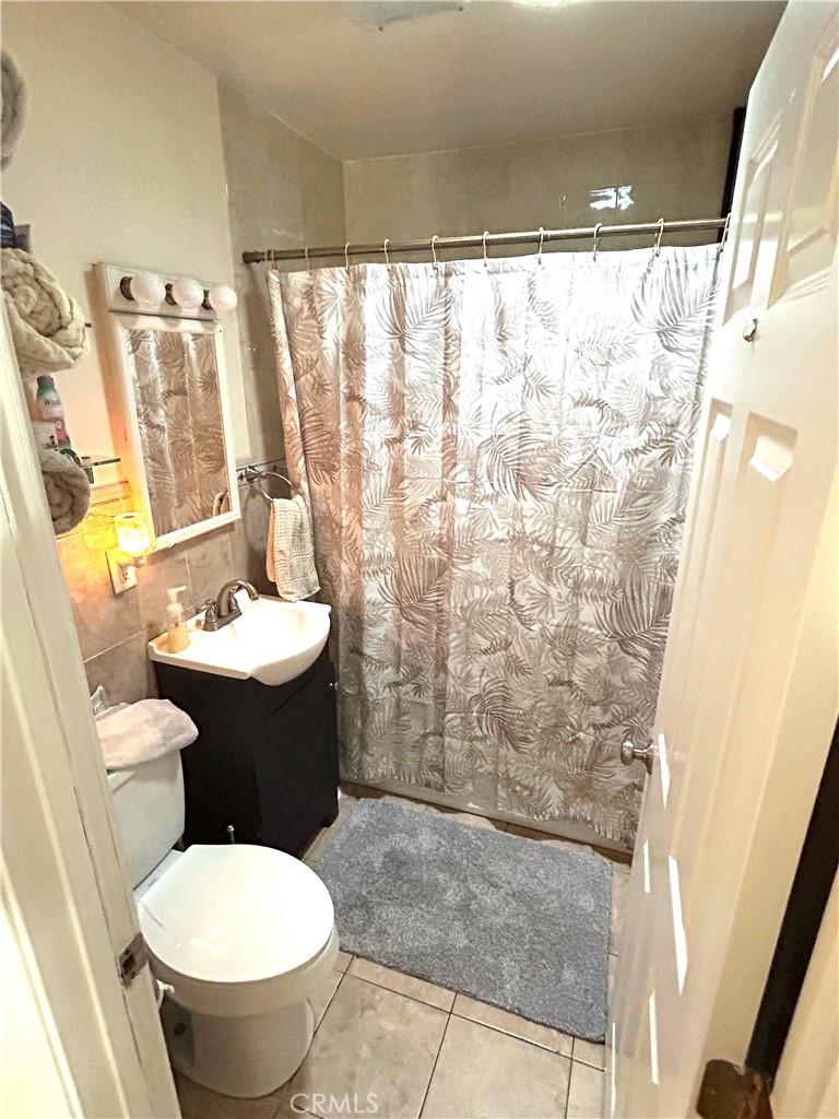 9530 Bexley Drive Pico Rivera, CA 90660 - Photo 18 of 22 a bathroom with a sink toilet and shower