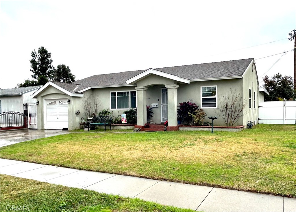 9530 Bexley Drive Pico Rivera, CA 90660 - Photo 2 of 22 a view of a house with swimming pool and a yard