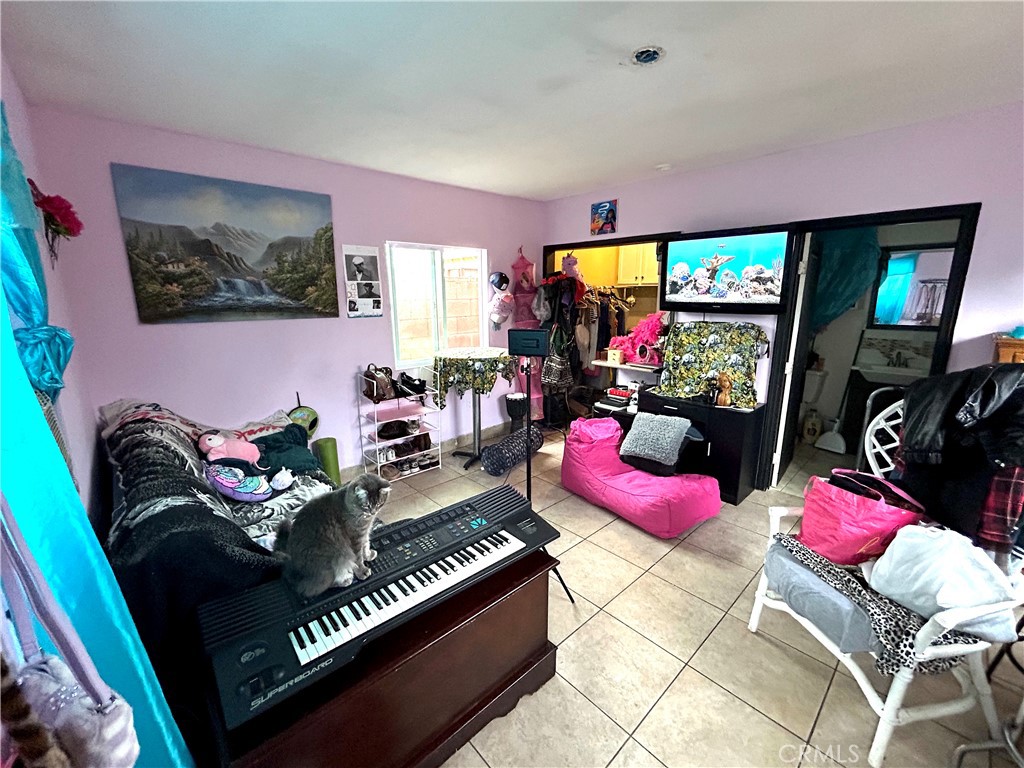 9530 Bexley Drive Pico Rivera, CA 90660 - Photo 21 of 22 a living room with furniture and a flat screen tv