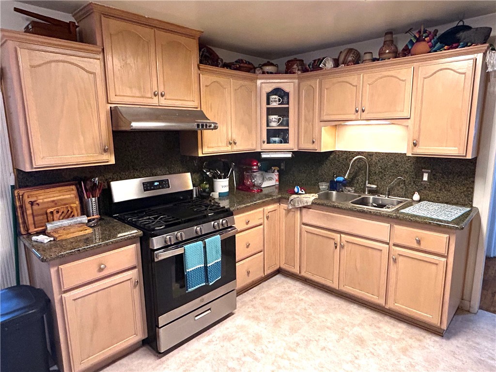 9530 Bexley Drive Pico Rivera, CA 90660 - Photo 8 of 22 a kitchen with granite countertop cabinets stainless steel appliances and a sink