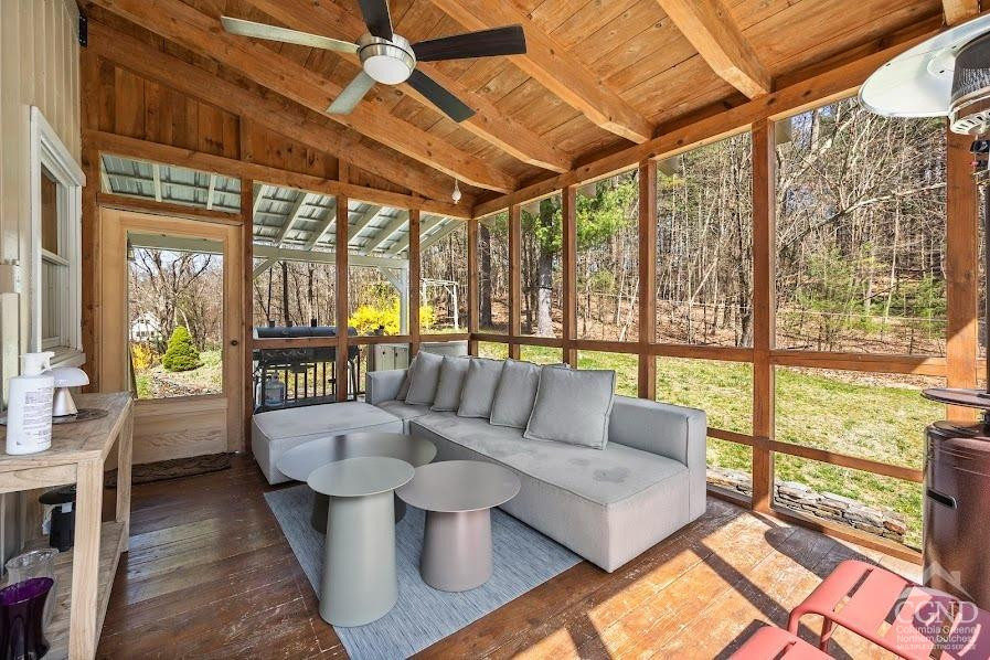 167 Dunbar Road Claverack, NY 12534 - Photo 12 of 37 a living room with furniture and a floor to ceiling window