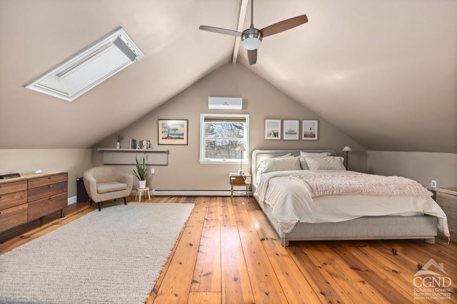 167 Dunbar Road Claverack, NY 12534 - Photo 15 of 37 a bedroom with a large bed and a chandelier