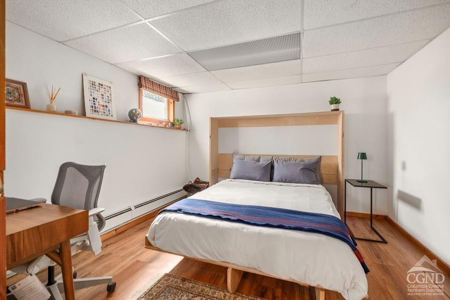 167 Dunbar Road Claverack, NY 12534 - Photo 21 of 37 a bedroom with a bed and wooden floor