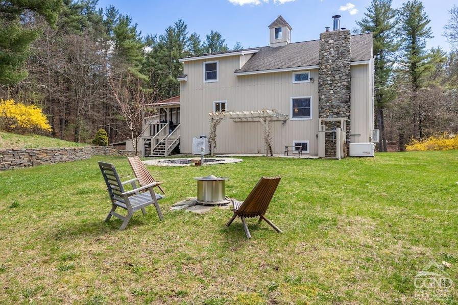 167 Dunbar Road Claverack, NY 12534 - Photo 25 of 37 a view of a house with backyard sitting area and garden