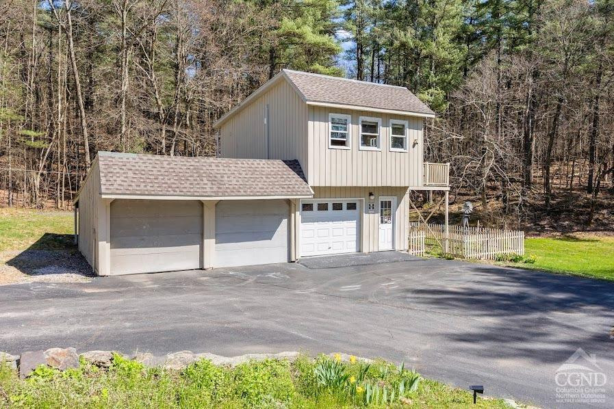 167 Dunbar Road Claverack, NY 12534 - Photo 28 of 37 a front view of a house with a yard and garage