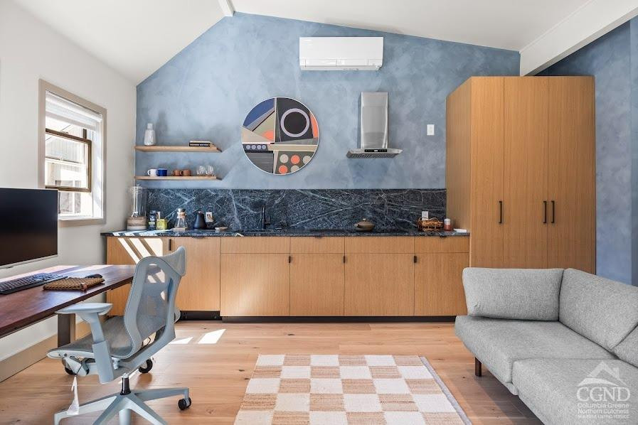 167 Dunbar Road Claverack, NY 12534 - Photo 29 of 37 a living room with stainless steel appliances kitchen island granite countertop furniture and a wooden floor