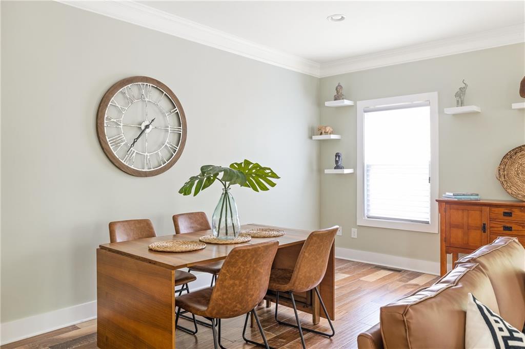 1333 Oakview Road Decatur, GA 30030 - Photo 7 of 28 a dining room with furniture and wooden floor