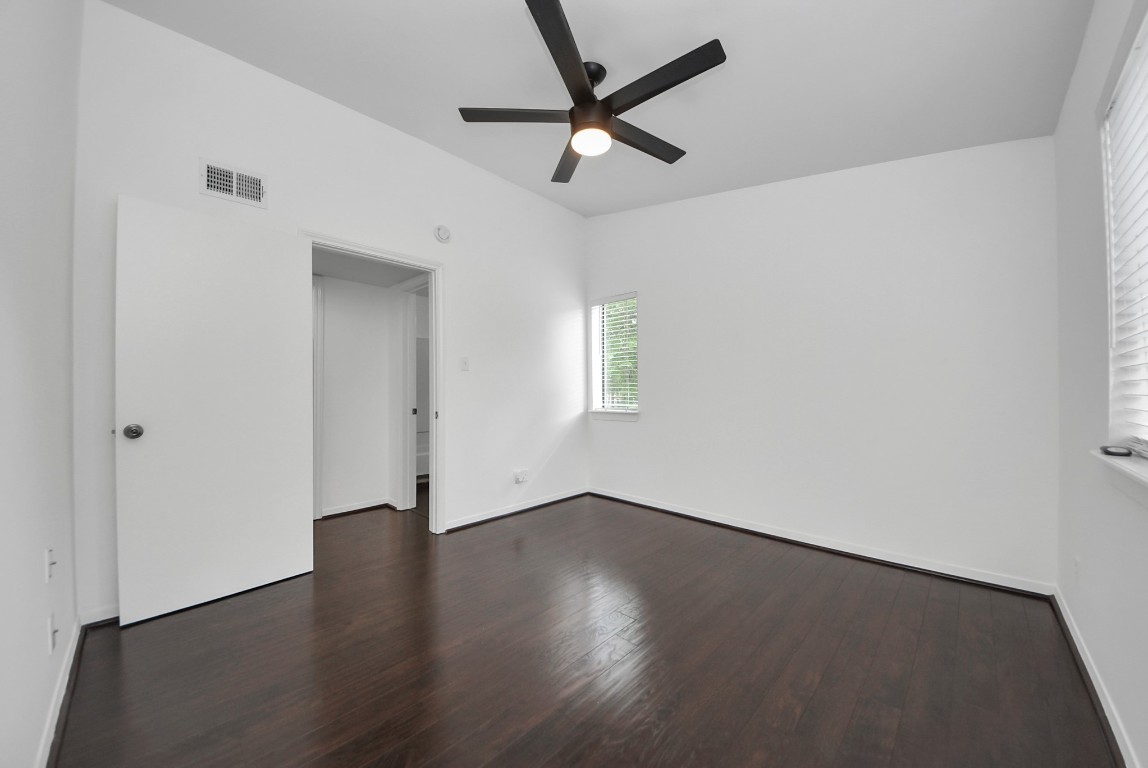 3500 Tangle Brush Drive, Unit 8 Spring, TX 77381 - Photo 15 of 32 Primary suite with vaulted ceiling, large window for natural light, and ceiling fan for added comfort