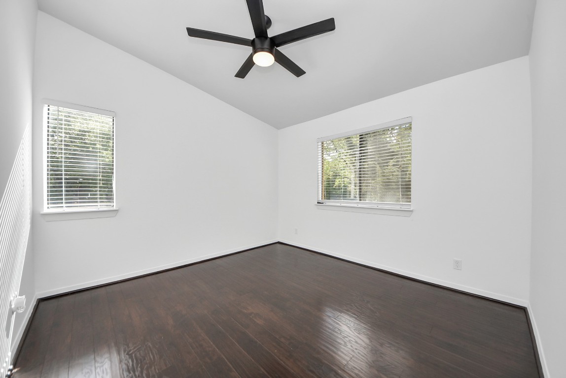 3500 Tangle Brush Drive, Unit 8 Spring, TX 77381 - Photo 16 of 32 Spacious primary bedroom featuring a vaulted ceiling, large window fill the space with natural light and ceiling fan