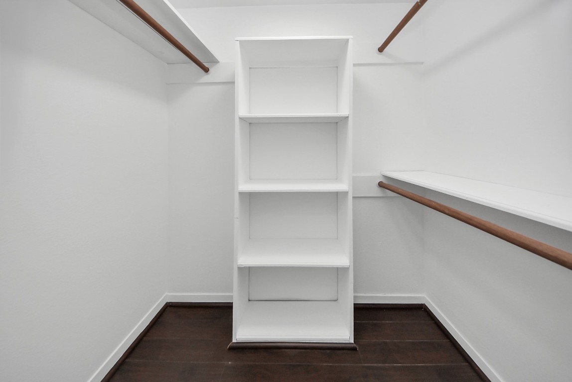 3500 Tangle Brush Drive, Unit 8 Spring, TX 77381 - Photo 19 of 32 A functional walk-in closet featuring built-in shelving and ample hanging space