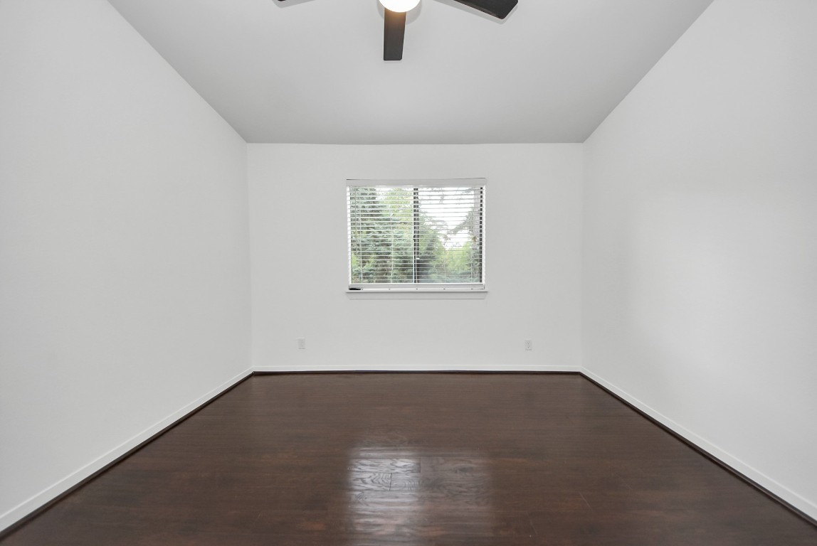 3500 Tangle Brush Drive, Unit 8 Spring, TX 77381 - Photo 21 of 32 Secondary bedroom offering a large window and ceiling fan for comfort