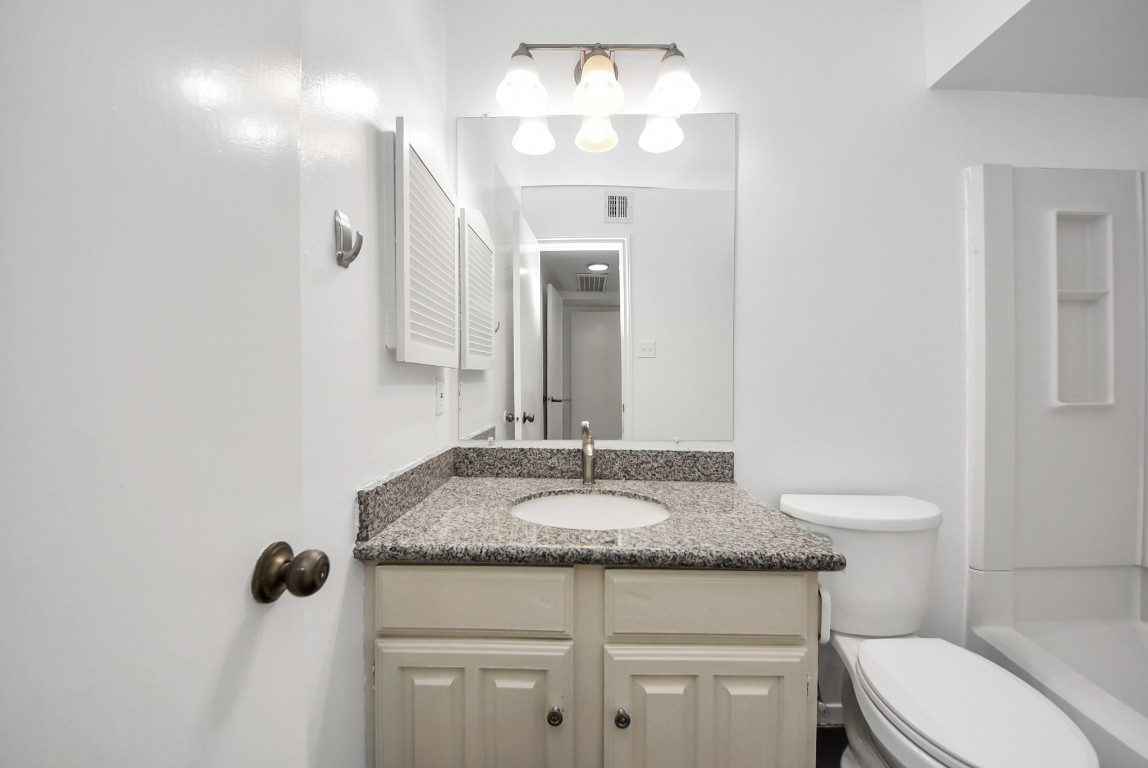3500 Tangle Brush Drive, Unit 8 Spring, TX 77381 - Photo 22 of 32 Bathroom featuring a vanity and dedicated storage space