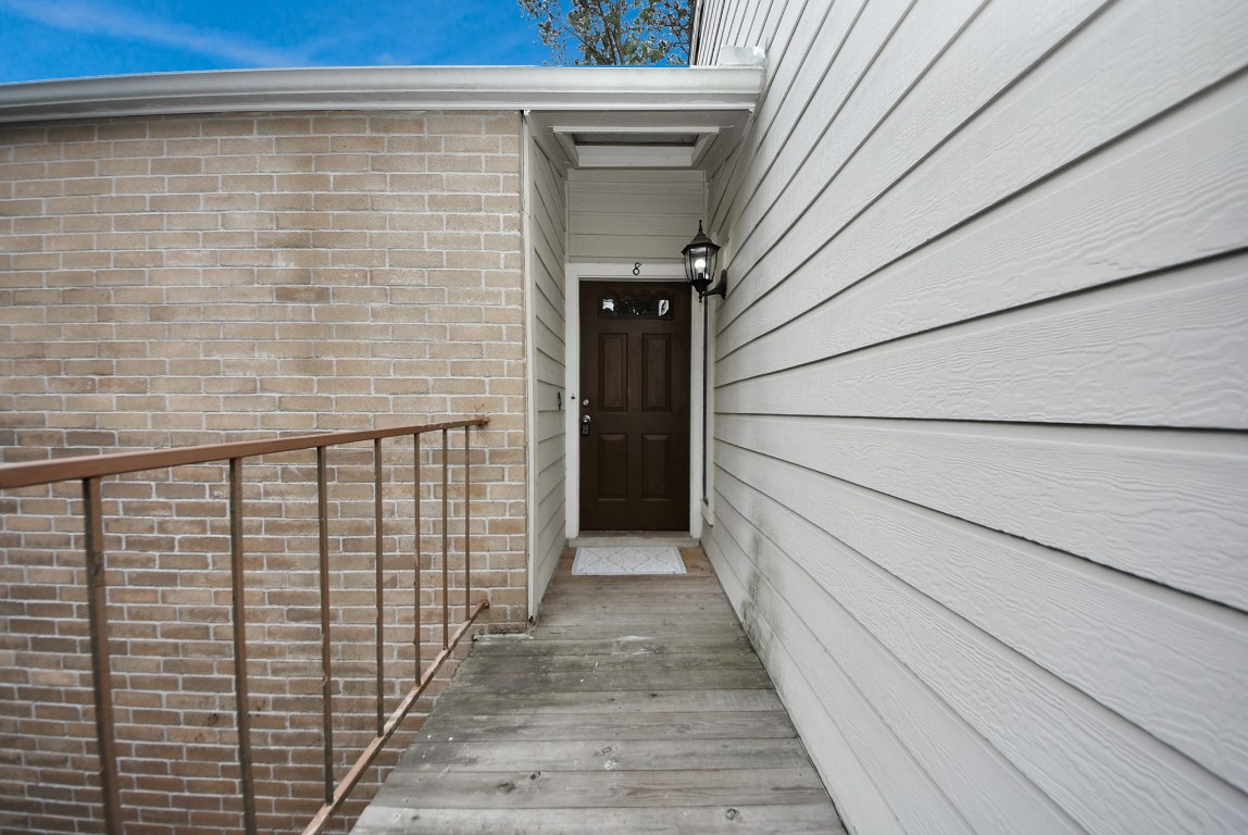 3500 Tangle Brush Drive, Unit 8 Spring, TX 77381 - Photo 27 of 32 A private, covered entrance with classic brick accents and a secure front door