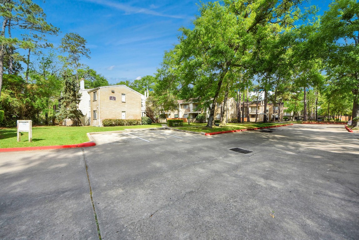3500 Tangle Brush Drive, Unit 8 Spring, TX 77381 - Photo 30 of 32 Well-maintained parking area that has easy access to the surrounding green space