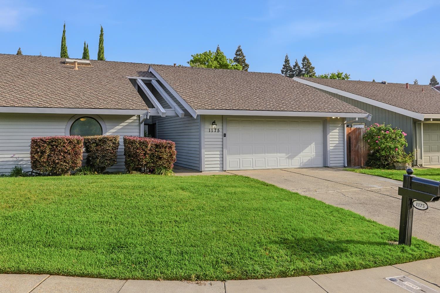 1175 Rose Tree Way Sacramento, CA 95831 - Photo 1 of 33 a front view of a house with a yard