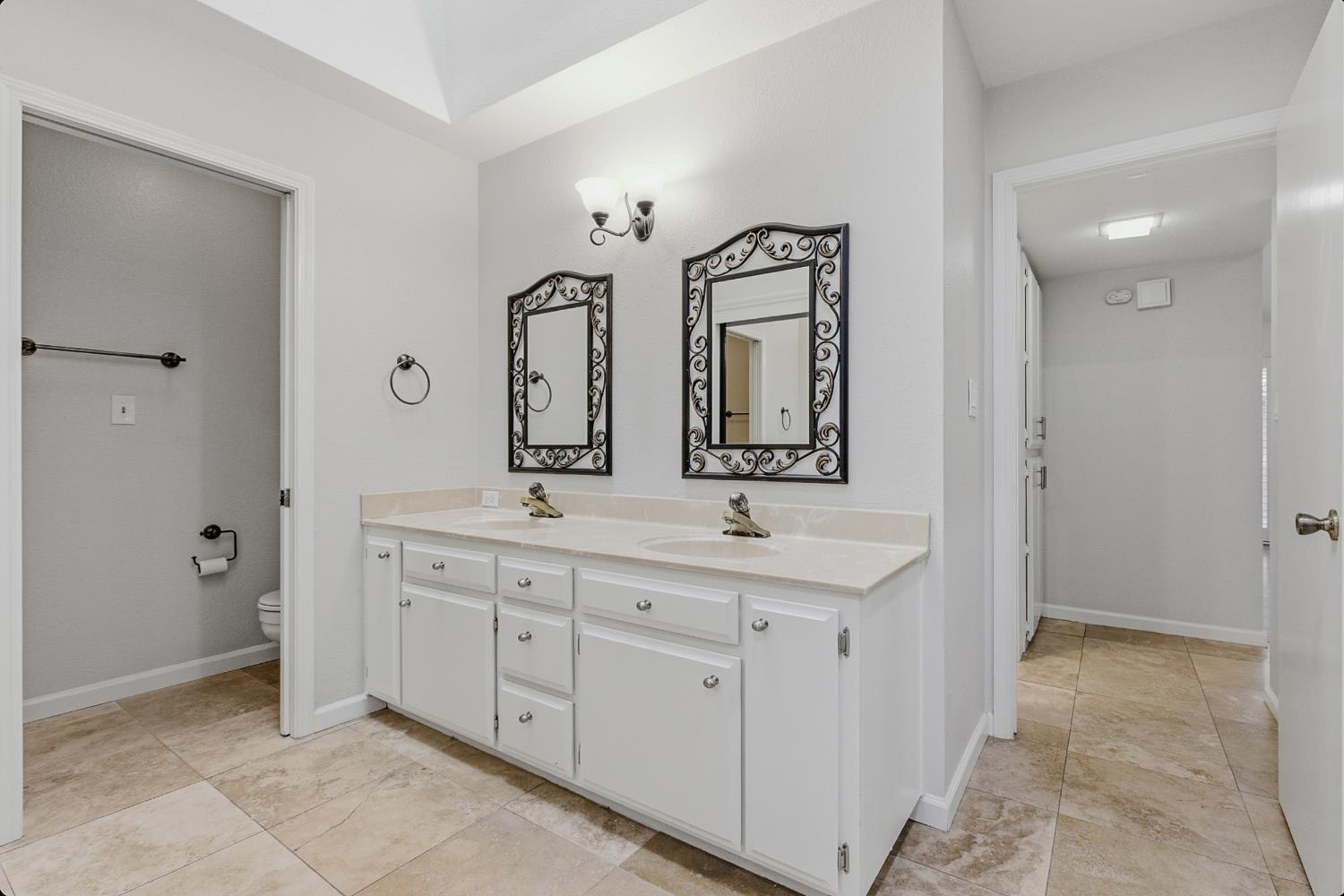 1175 Rose Tree Way Sacramento, CA 95831 - Photo 18 of 33 a spacious bathroom with a double vanity sink mirror and