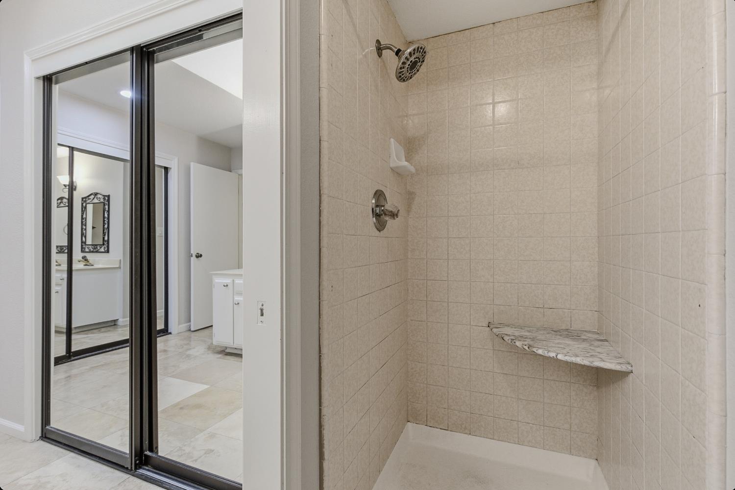 1175 Rose Tree Way Sacramento, CA 95831 - Photo 19 of 33 a bathroom with a glass shower door